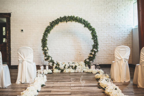 Circle Greenery wedding ceremony arch 
